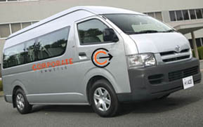 Side view of a branded Corporate Shuttle people mover