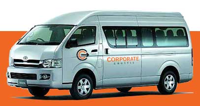 A Corporate Shuttle branded Toyota HiAce commuter bus